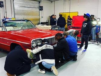 Students checking out EV project car