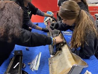 EV project car students working on bumper