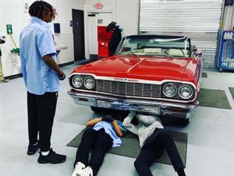 EV project car with students underneath