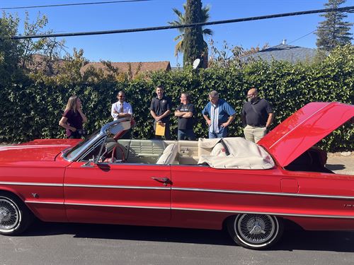 Students standing behind EV Lowrider Conversion Project Car