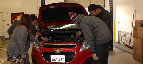 Students working on a car