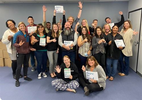 SAVA Teachers holding Dare to Lead signs